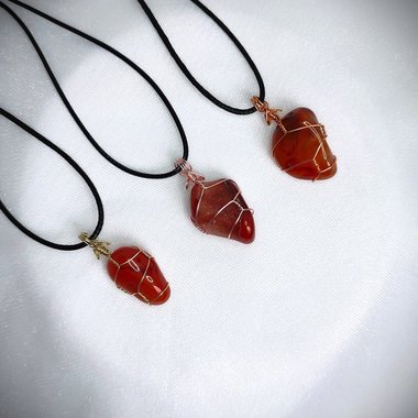 Carnelian tumblestone wrapped in gold, rose gold or copper wire.