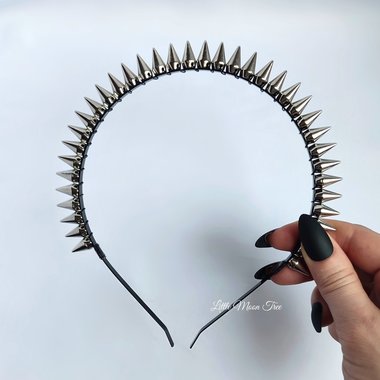 Studded headband with silver spikes wire wrapped onto a black headband.