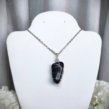 Obsidian wire wrapped pendant in silver with chain or cord.