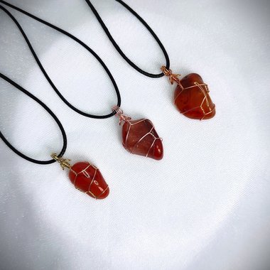 Carnelian tumblestone wrapped in gold, rose gold or copper wire.
